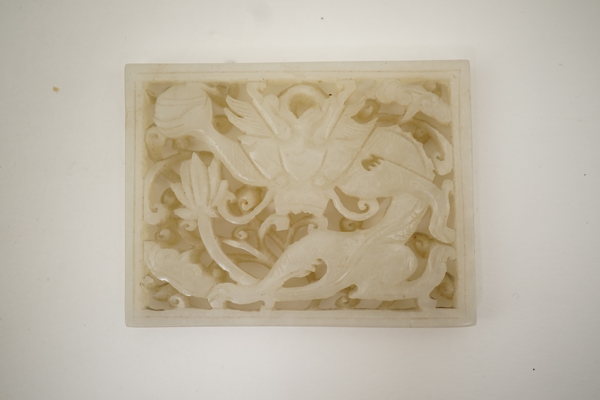 A Chinese reticulated white jade ‘dragon’ plaque, 18th century